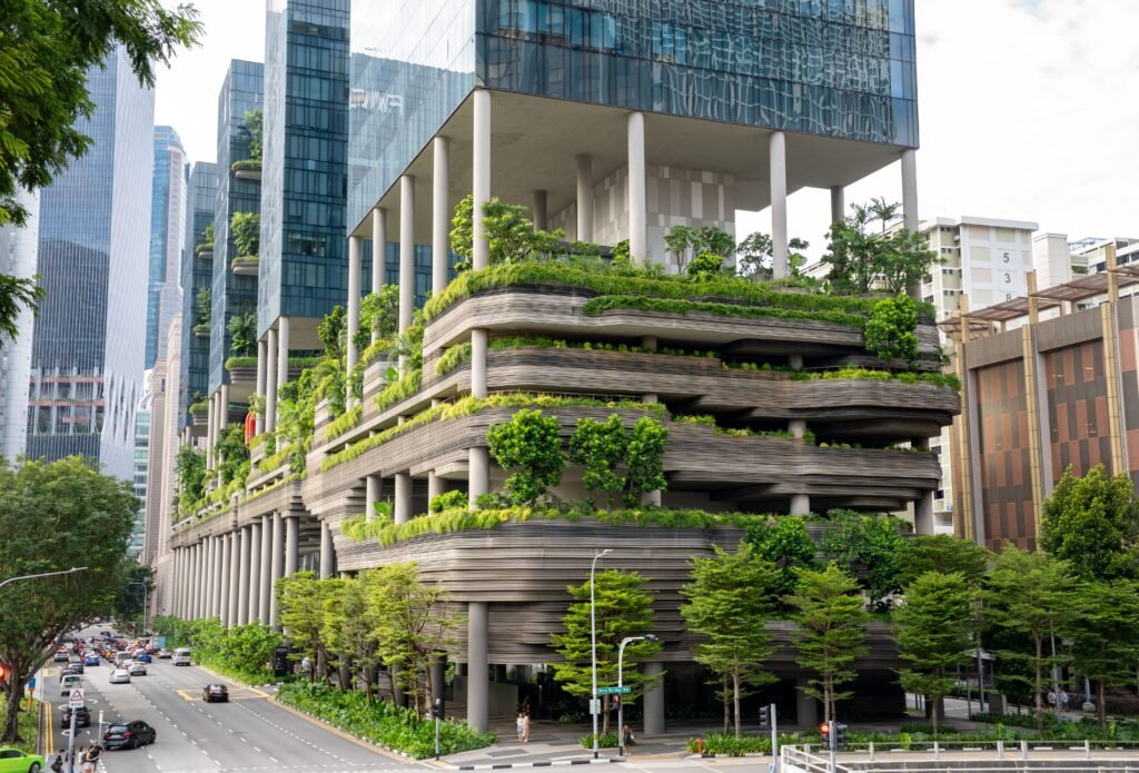 Modern high-rise with vertical garden, showcasing urban sustainable design.
